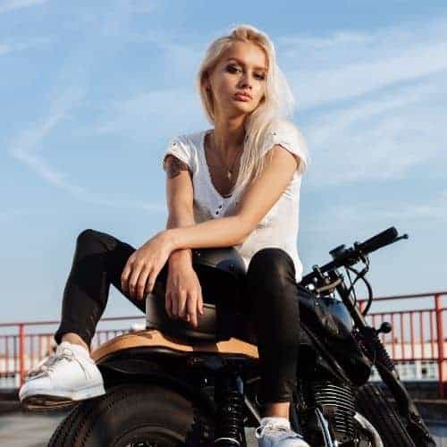 Young woman on a motor-bike