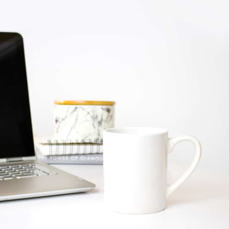 Laptop and Coffee Cup on a Business Womans Desk